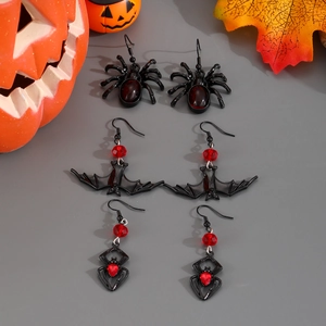 Gothic Halloween earrings set featuring black spider and bat charms with red gemstones