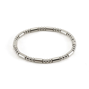Polished silver stainless steel bangle with beaded and cylinder link texture detail