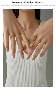 Detailed view of S925 silver gold-plated chain ring with sparkling diamond letter charms