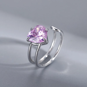 Irregular silver ring with heart-shaped pink zircon in a modern minimalist style