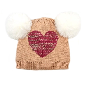 Detail of khaki knit baby hat with red heart pattern and dual white faux fur pom-poms