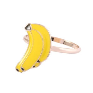 Detailed close-up of alloy banana-shaped napkin ring with yellow enamel on rose gold band
