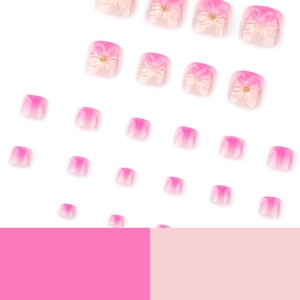 Unghie finte per piedi sfumate rosa e bianco con fiocchi 3D e perline dorate