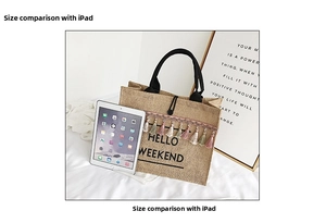 Linen tote bag with Hello Weekend print and tassels shown next to an iPad for size scale