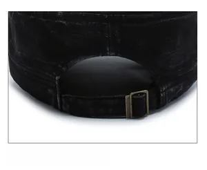 Detail view of adjustable metal buckle and vintage washed fabric on flat top cap