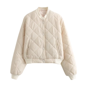 Quilted cream bomber jacket with ribbed collar and snap buttons on a white background
