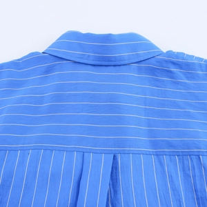 Detail of blue and white striped shirt back with horizontal yoke and vertical pleats