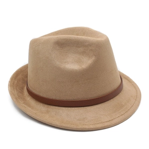 Detailed view of khaki suede fedora hat with a dark brown leather band and fine stitching