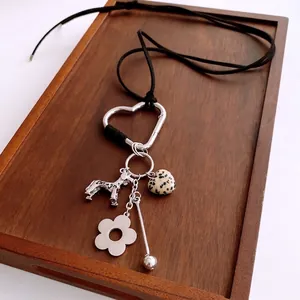 Vintage cotton rope necklace with silver heart carabiner and dalmatian dog pendant