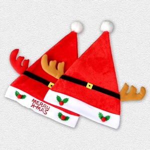 Detail of Christmas hats with plush reindeer antlers and Merry X-mas embroidery
