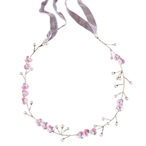 Detailed view of handmade bridal headband with purple gradient flowers and white pearls