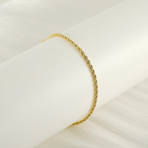 Minimalist 18k gold plated stainless steel twist chain anklet for women on a white display