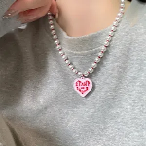 Y2K vintage pearl necklace with pink heart pendant featuring That's My Best engraving