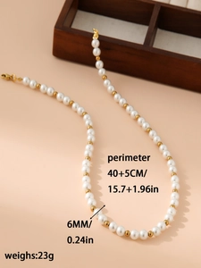 Detail view of 6mm pearl and gold bead necklace with 40+5cm length and lobster clasp