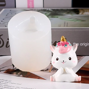Detailed view of white silicone mold and finished unicorn rabbit handmade sculpture