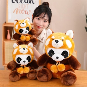 Three sizes of plush teddy bear wearing raccoon outfits held by a smiling woman