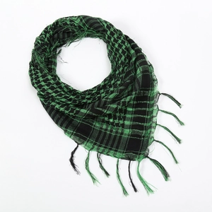 Close-up of green and black tactical shemagh scarf featuring woven fringe details
