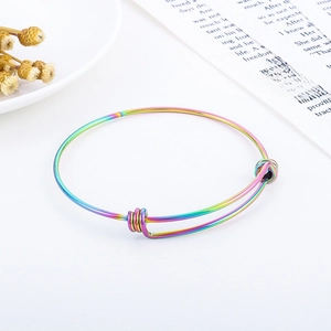 Macro detail of rainbow gradient stainless steel wire bracelet with adjustable sliding knot