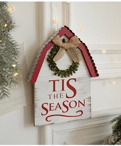 Detail of wooden Christmas barn sign with burlap bow and 'Tis the Season' slogan