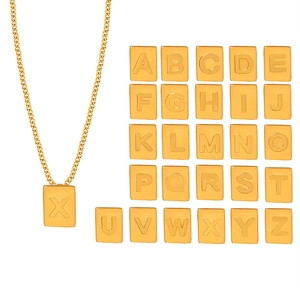 Square gold letter pendant necklace in stainless steel featuring A-Z alphabet designs
