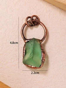 Detailed view of irregular green quartz stone pendant with bronze metal wrap and dimensions