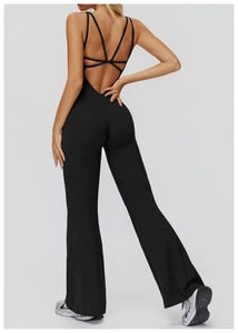 Detailed back view of a black yoga jumpsuit featuring crossover straps and flared leg design