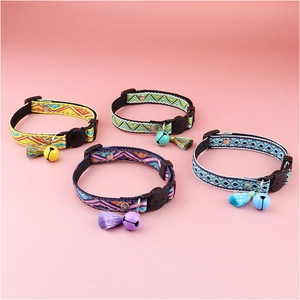 Detail of adjustable plaid cat collars with tassels and bells in four vibrant colors