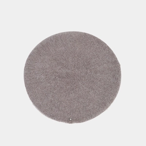 Top-down view of knitted wool beret showing spiral texture and silver metal button detail