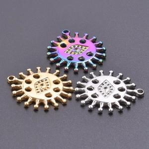 Detail of sun shaped eye pendants in rainbow, gold, and silver finishes for DIY jewelry