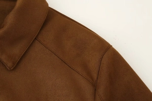 Detail of dark brown faux suede jacket showing high-quality stitching and collar texture