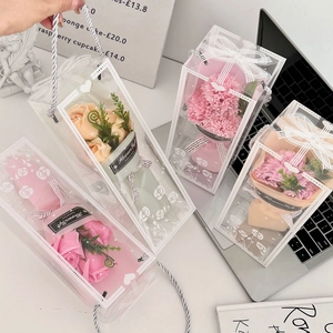Detail of four soap flower bouquets in transparent gift boxes with Forever Love tags
