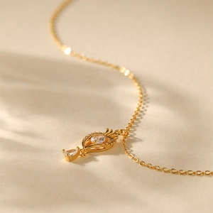 Detailed close-up of 18K gold plated flower necklace with zircon crystal teardrop pendant
