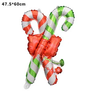 Close-up of candy cane foil balloons with red bow for Christmas party decoration
