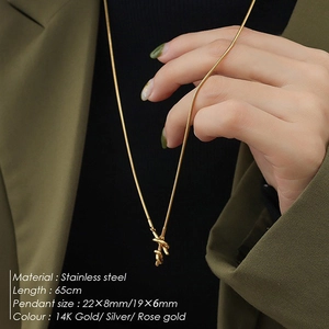 Detail view of titanium steel long necklace pendants in gold, silver and rose gold