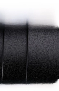 Close-up of premium Italian top grain black leather belt showing natural pore texture