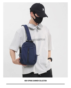 Blue waterproof oxford fabric chest bag shown on model for urban sport styling