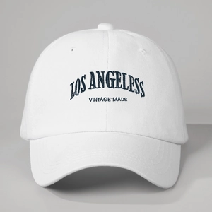 White vintage baseball cap with navy blue Los Angeles embroidery and soft cotton top