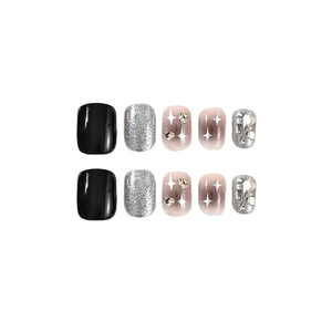 Short square black and silver glitter press-on nails with star patterns and rhinestones