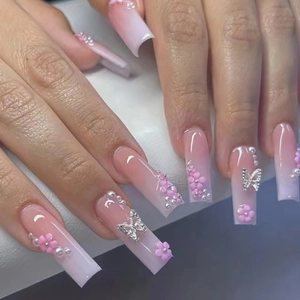 Extra long square nails with pink gradient, 3D flowers, pearls, and silver butterflies