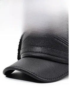 Macro detail of high-quality black lychee grain leather winter hat with thermal faux fur lining