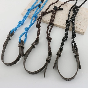 Detail of colorful braided eyewear chains in blue, brown, and black with leather accents