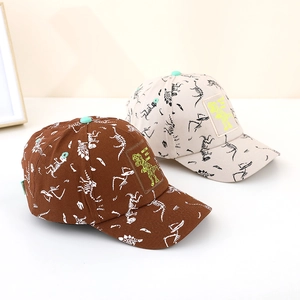 Close-up of kids dinosaur baseball cap featuring detailed skeleton prints and patch
