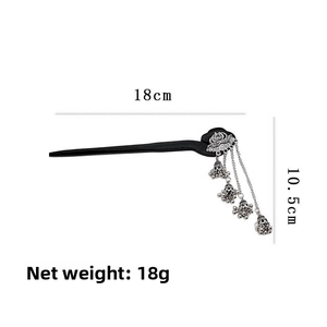Detail of wooden hair stick with silver lotus flower and tassel charms with measurements
