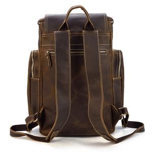 Detail view of the back of a vintage crazy horse leather backpack with rear zipper pocket