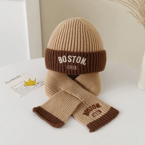 Detail of Boston 1630 letter embroidery on beige knit hat and scarf set for children