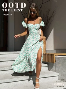 Detail of floral off-shoulder dress featuring a high slit and puff sleeves in sunlight