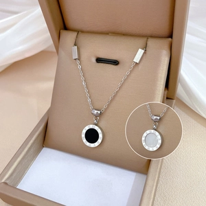 Minimalist titanium steel necklace with Roman numerals pendant on beige jewelry box