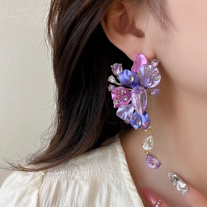 Statement oversized purple flower earrings with sparkling rhinestones and crystal tassels