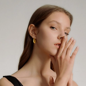 Minimalist gold-plated hollow C-shape hoop earrings for women in a polished metallic finish