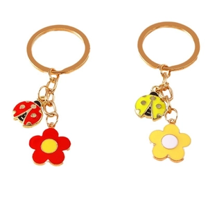 Pastel enamel floral and ladybug keychain set in gold metal finish for bags and keys